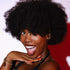 Woman in a black outfit with a red background